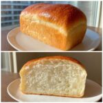A golden-brown loaf of soft condensed milk bread shown whole and sliced to reveal a fluffy white interior.