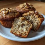 Three Banana Walnut Cottage Cheese Muffin Breakfasts, one cut in half showing the moist interior and walnuts.