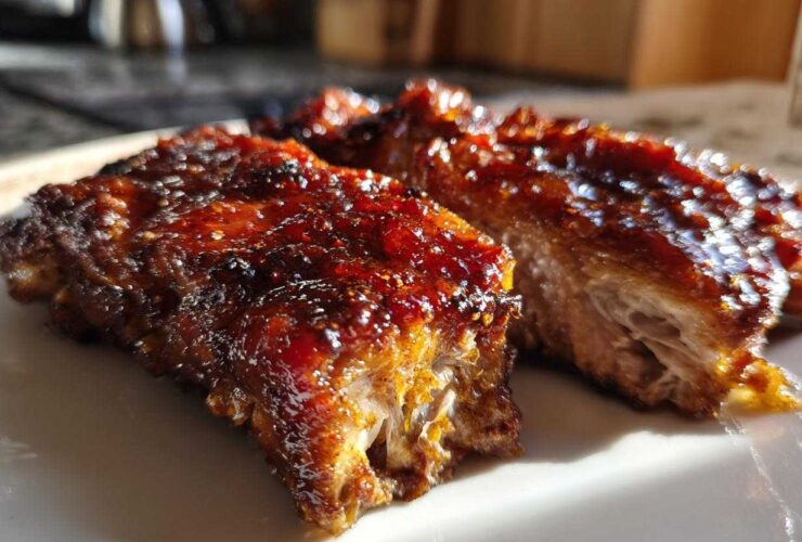 Close-up of juicy Honey Garlic Boneless Chicken Thighs with a thick, caramelized glaze.
