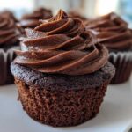 Close-up of a decadent chocolate cupcake topped with perfectly swirled chocolate Chocolate Cupcakes Frosting.